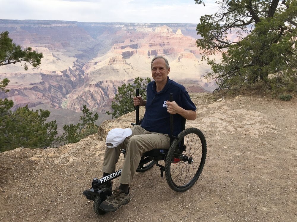 Tips for Planning an Accessible National Parks Trip - Freedom Chair rider Ralph seeing Grand Canyon National Park in Arizona.